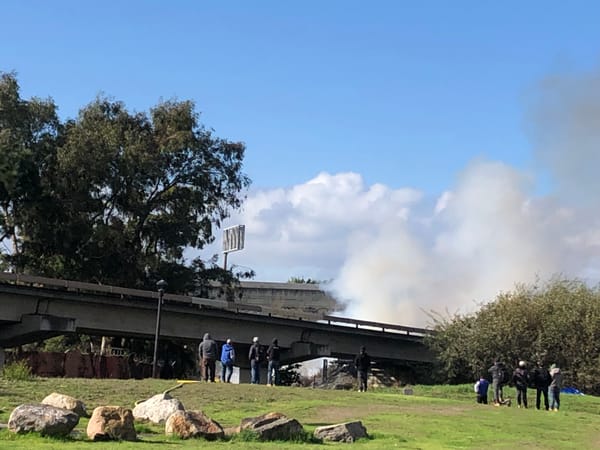 Fire breaks out along Greenway, sending smoke into neighborhood