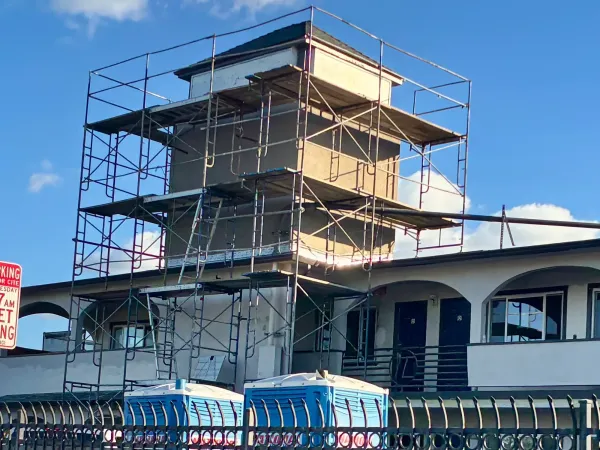 Exterior view of the former Motel 6 in Richmond under construction for a homeless housing conversion project